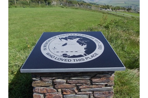 Memorial plaque at Maughold, black granite with part-polished edges, incised-only map