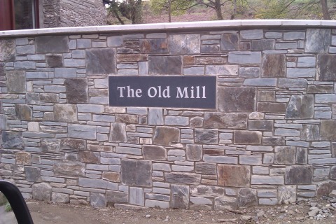 Property name plaque , unpolished black granite, silver painted lettering