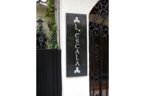 Property name plaque, black granite, white painted lettering