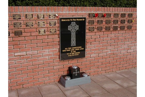 TT Memorial wall plaque at Douglas borough cemetery, black granite, incised-only design, gilded lettering